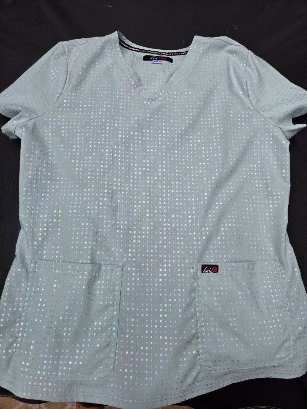 Koi lite, light mint green scrub top, size medium.